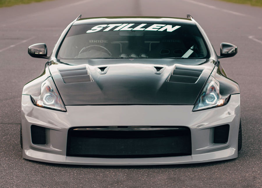 Silver sports car with a Stillen sunstrip